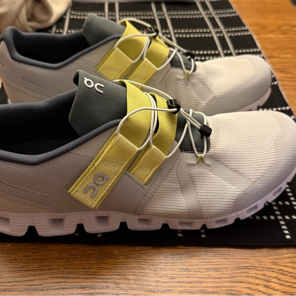 On Running White and Yellow Sneakers with Unique Strap System